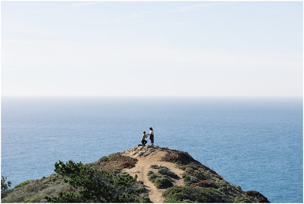 portrait of couple standing on mountain on coastline by film photographer AGS Photo Art