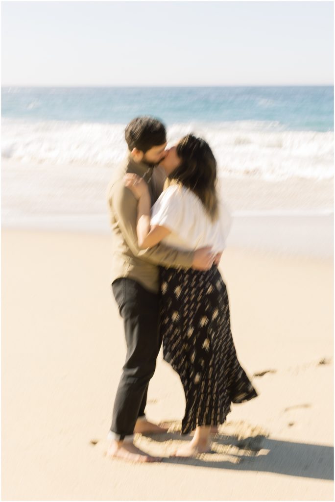 portrait of couple standing on beach in front of ocean by film photographer AGS Photo Art