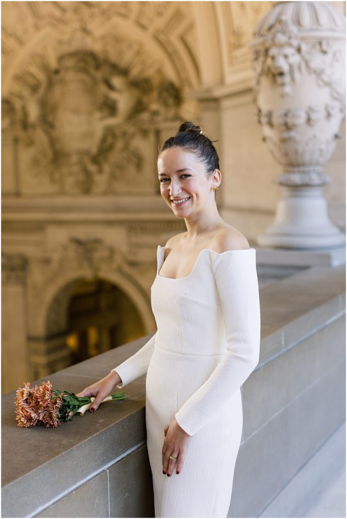 portrait of bride holding bouquet in city hall by film photographer AGS Photo Art