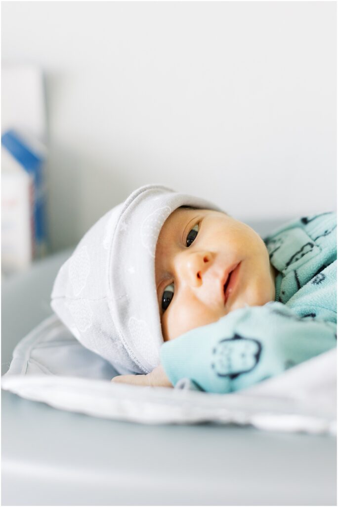 portrait of baby wearing gray hat on changing table by film photographer AGS Photo Art