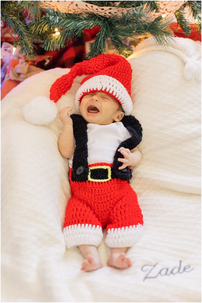 portrait of baby wearing red santa outfit by film photographer AGS Photo Art