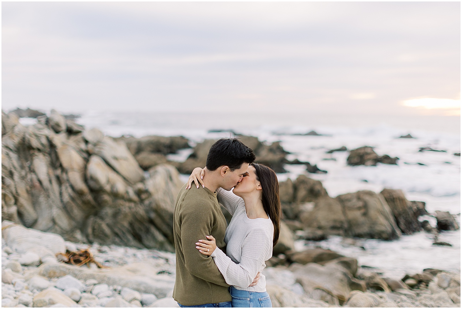 portrait of couple posing in front of the ocean at the beach by film photographer AGS Photo Art