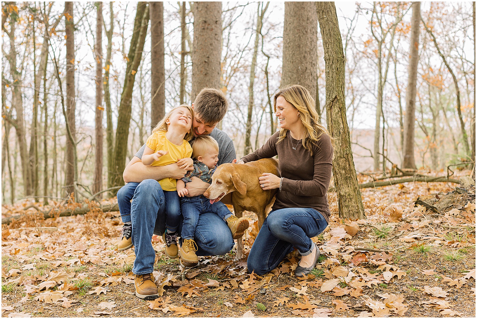 portrait of family posing in forest with leaves by film photographer AGS Photo Art