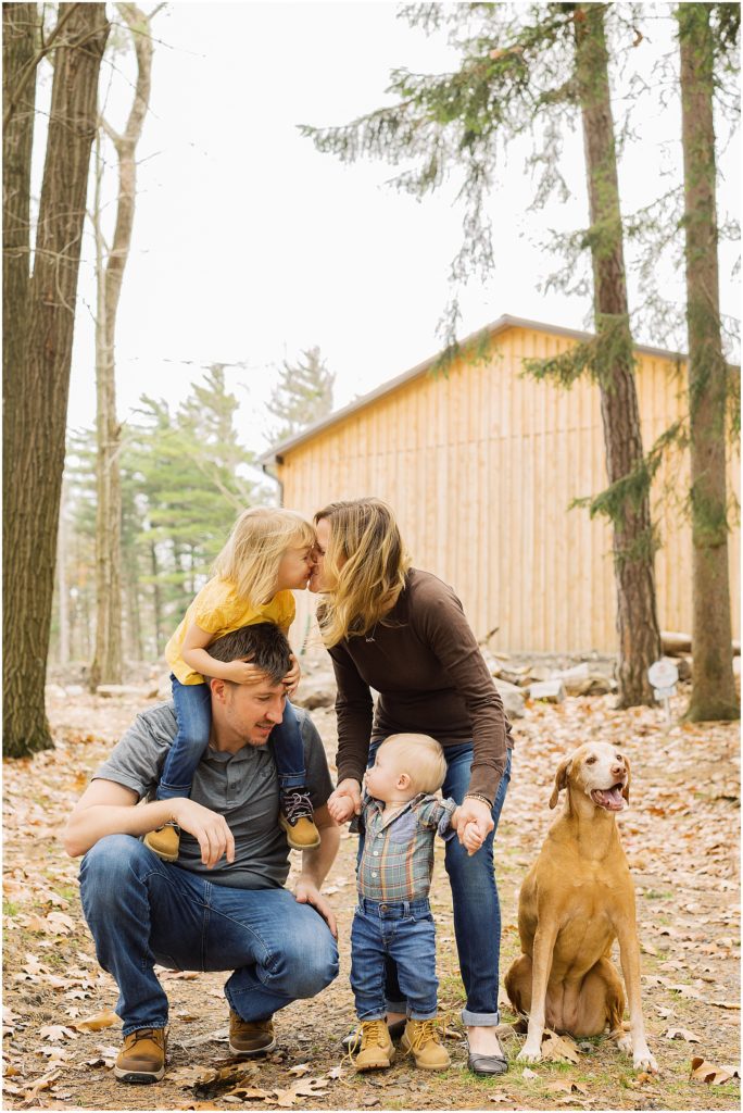 portrait of family in forest standing in front of barn by film photographer AGS Photo Art