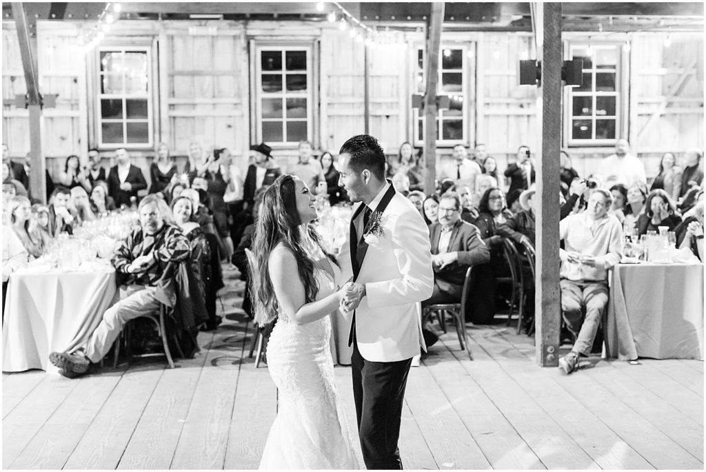 portrait of bride and groom having first dance on dance floor during reception by film photographer AGS Photo Art