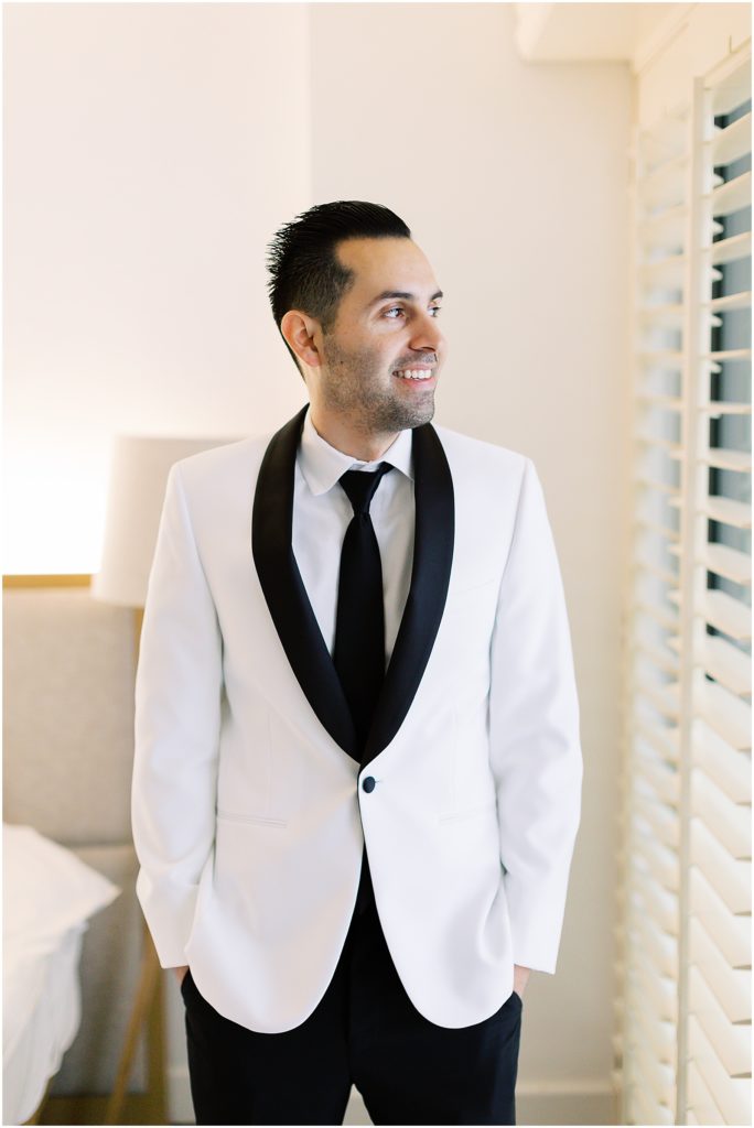 portrait of groom getting ready for ceremony by film photographer AGS Photo Art