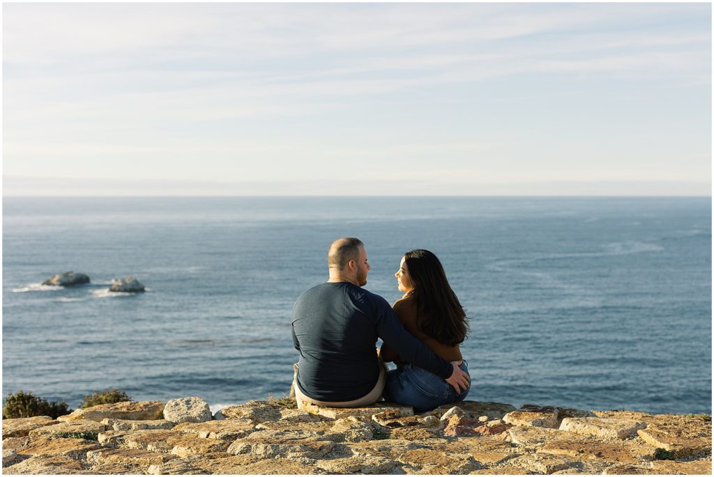 portrait of couple watching sunset by the ocean by film photographer AGS Photo Art