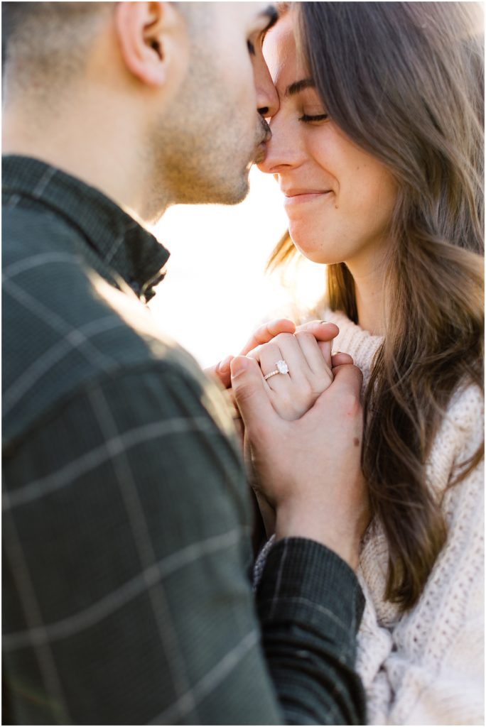 portrait of couple holding hands with diamond ring on display during surprise proposal by film photographer AGS Photo Art