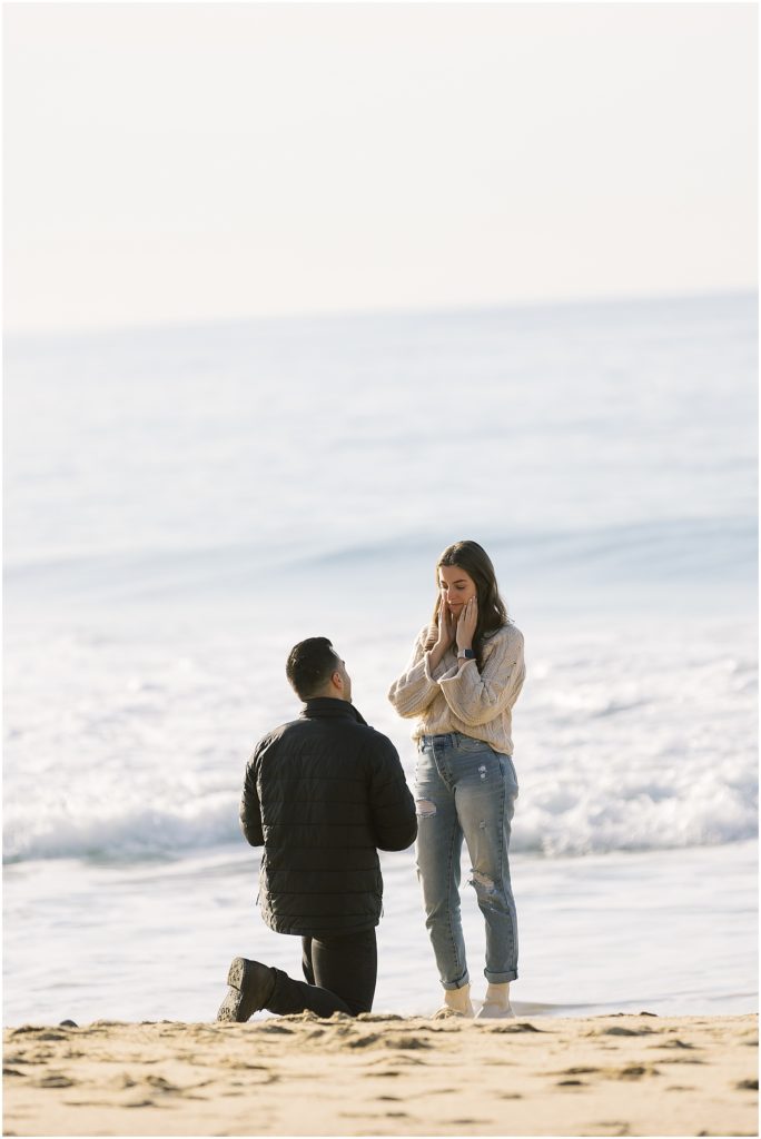 portrait of couple standing with ocean view during surprise proposal by film photographer AGS Photo Art