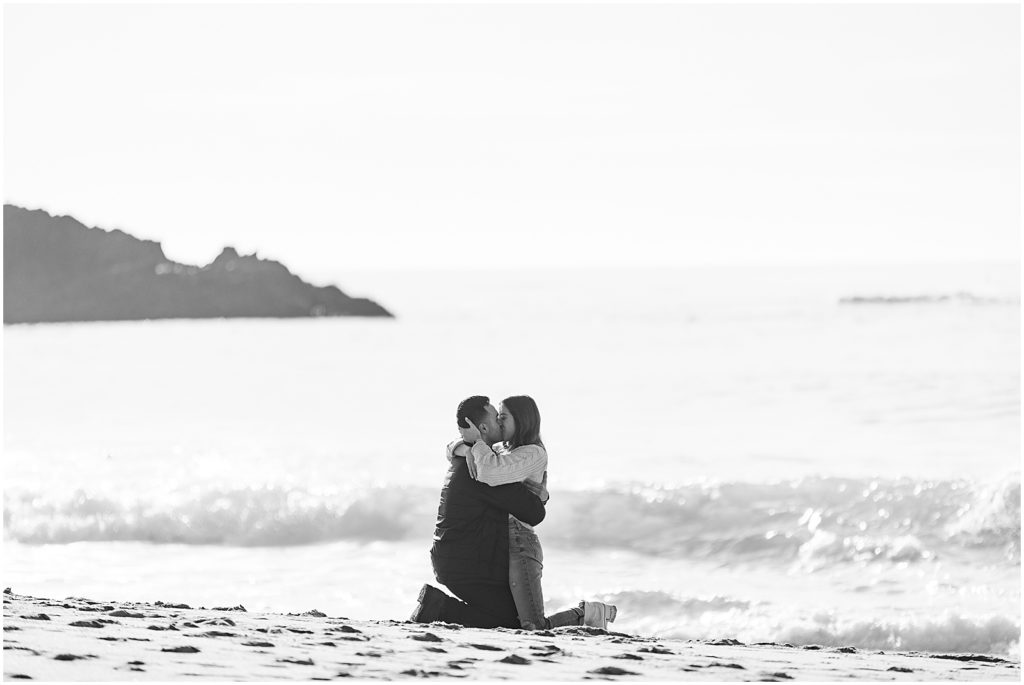 portrait of couple hugging on the shoreline during surprise proposal by film photographer AGS Photo Art