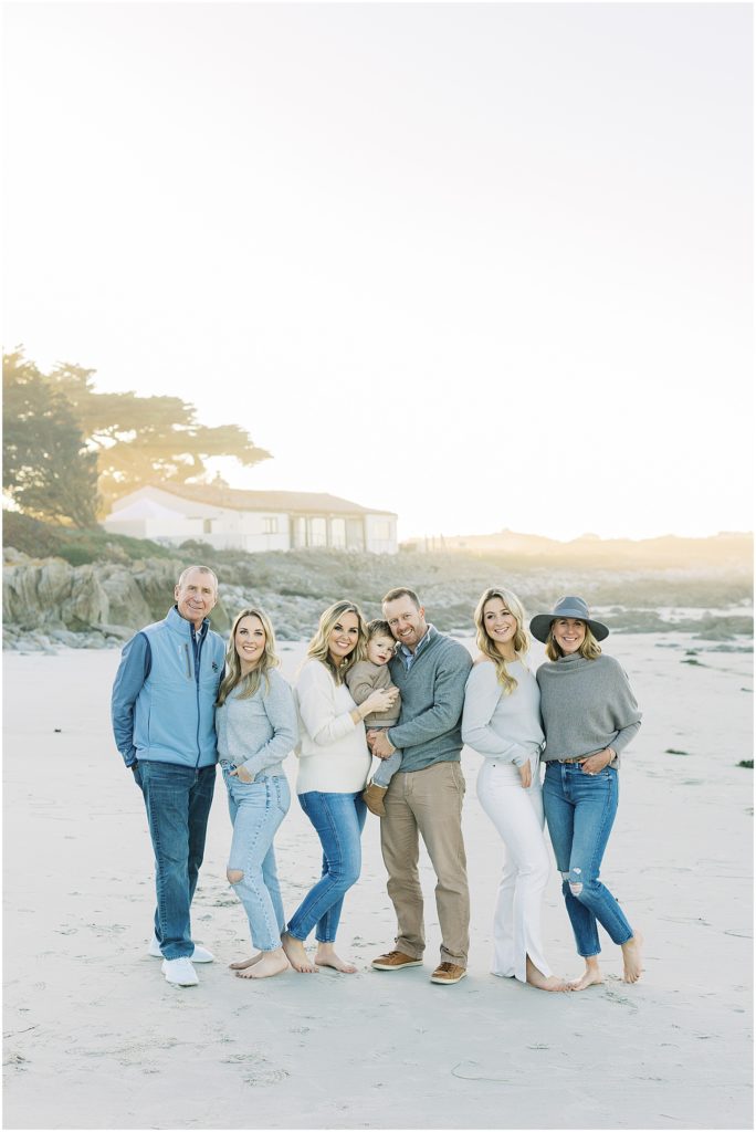 portrait of family standing together posing by the shore of the ocean by film photographer AGS Photo Art