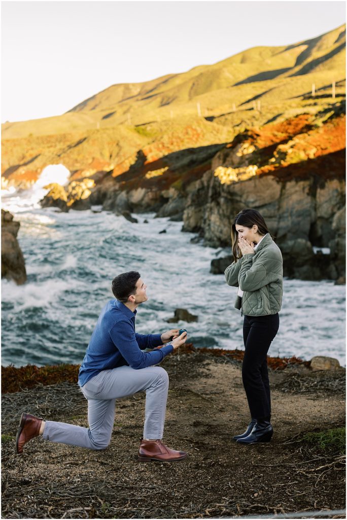 portrait of man kneeling with engagement ring in hand proposing to woman by film photographer AGS Photo Art