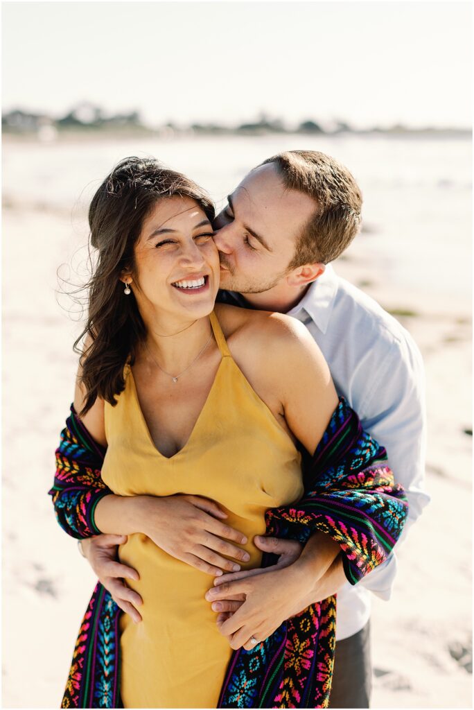 Pregnant couple laughing in Pebble Beach, shot by maternity photographer AGS Photo Art