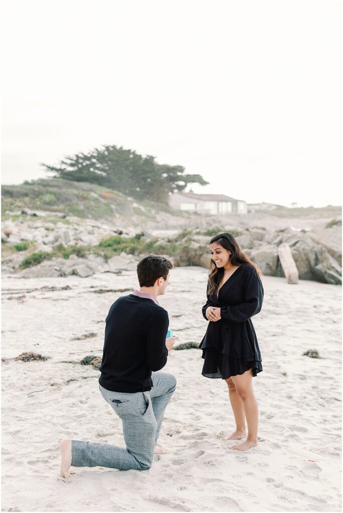 Boyfriend proposes with little blue box holding Tiffany engagement ring in Carmel, California.