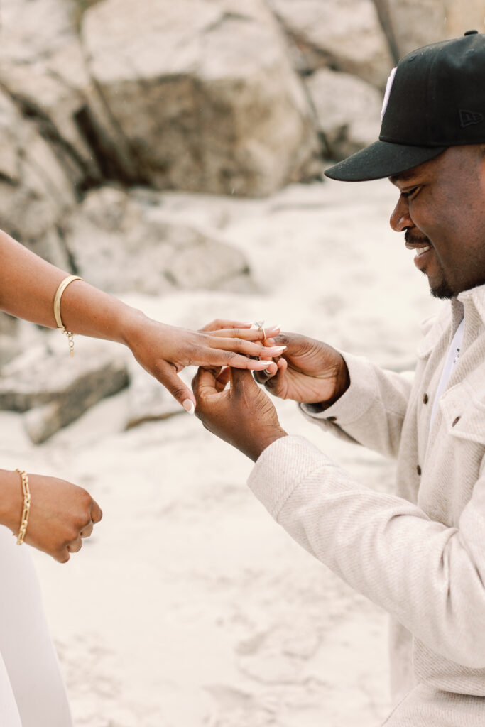 Spanish Bay proposal photographer capturing John down on one knee at sunset.