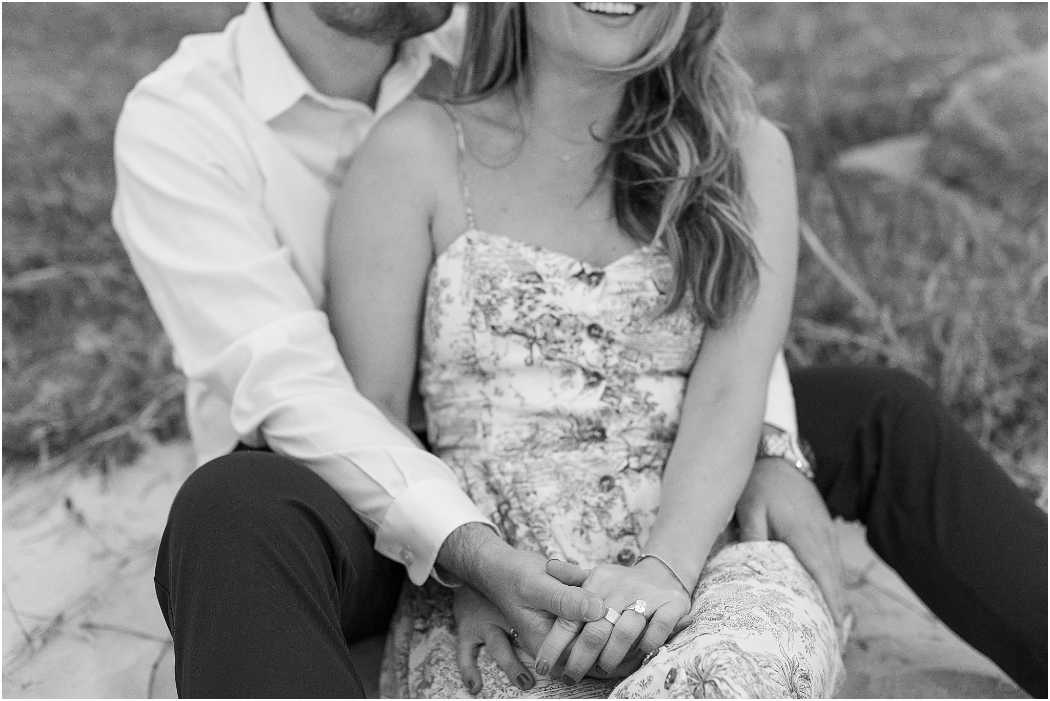 Black and white photo of engagement moment on Pebble Beach.