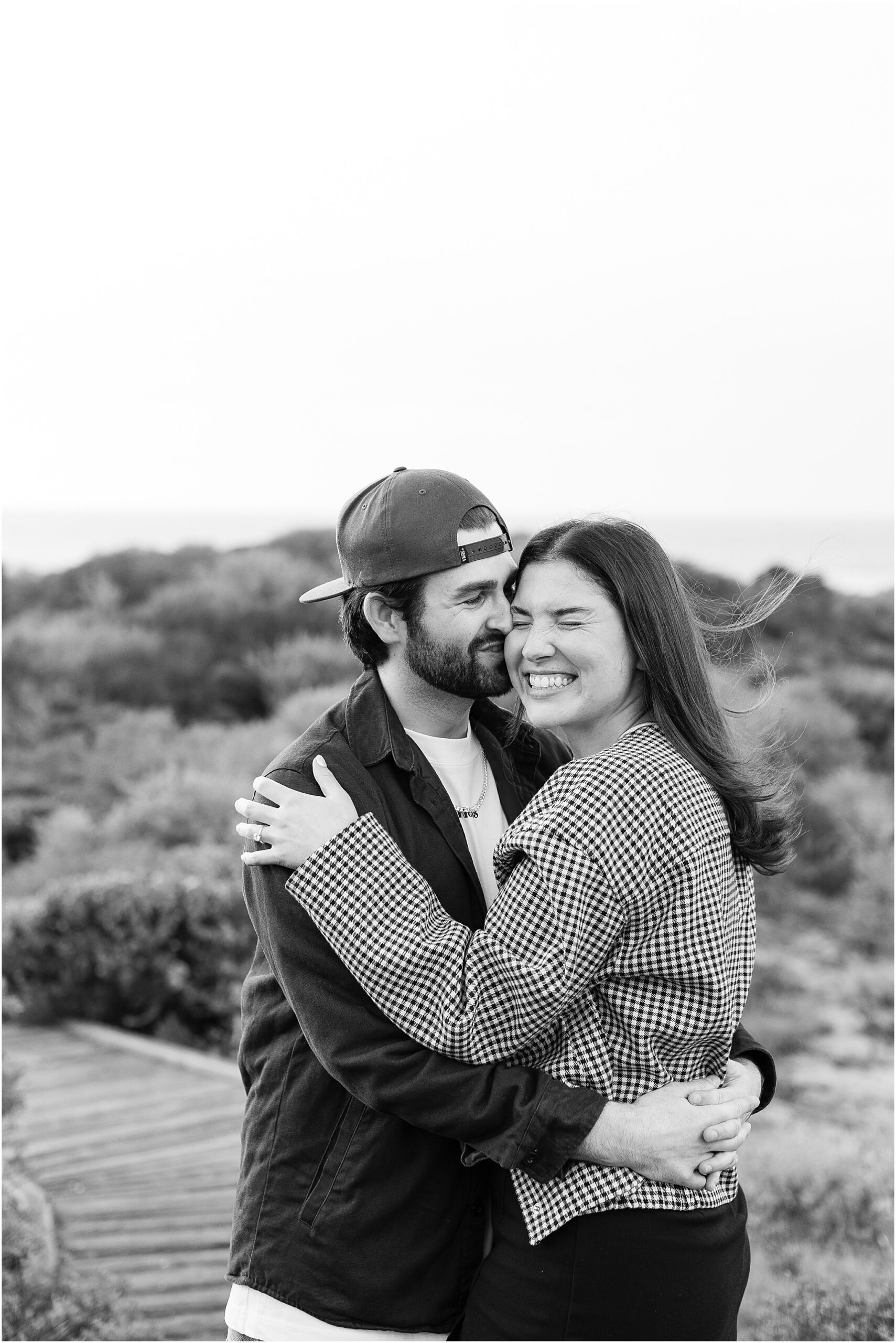 Joyful laughter between Calvin and Camille on the shore.