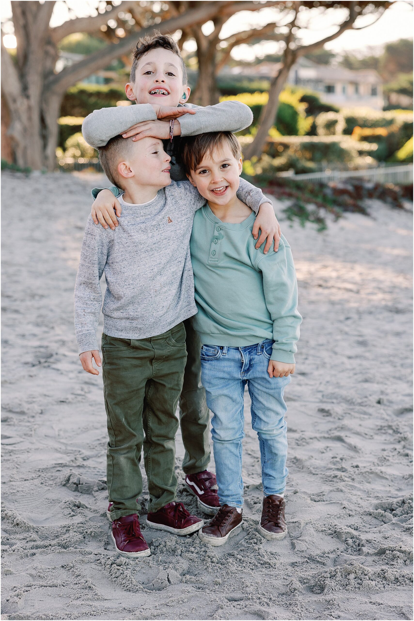 Playful candid moments from a Carmel beach family photoshoot.