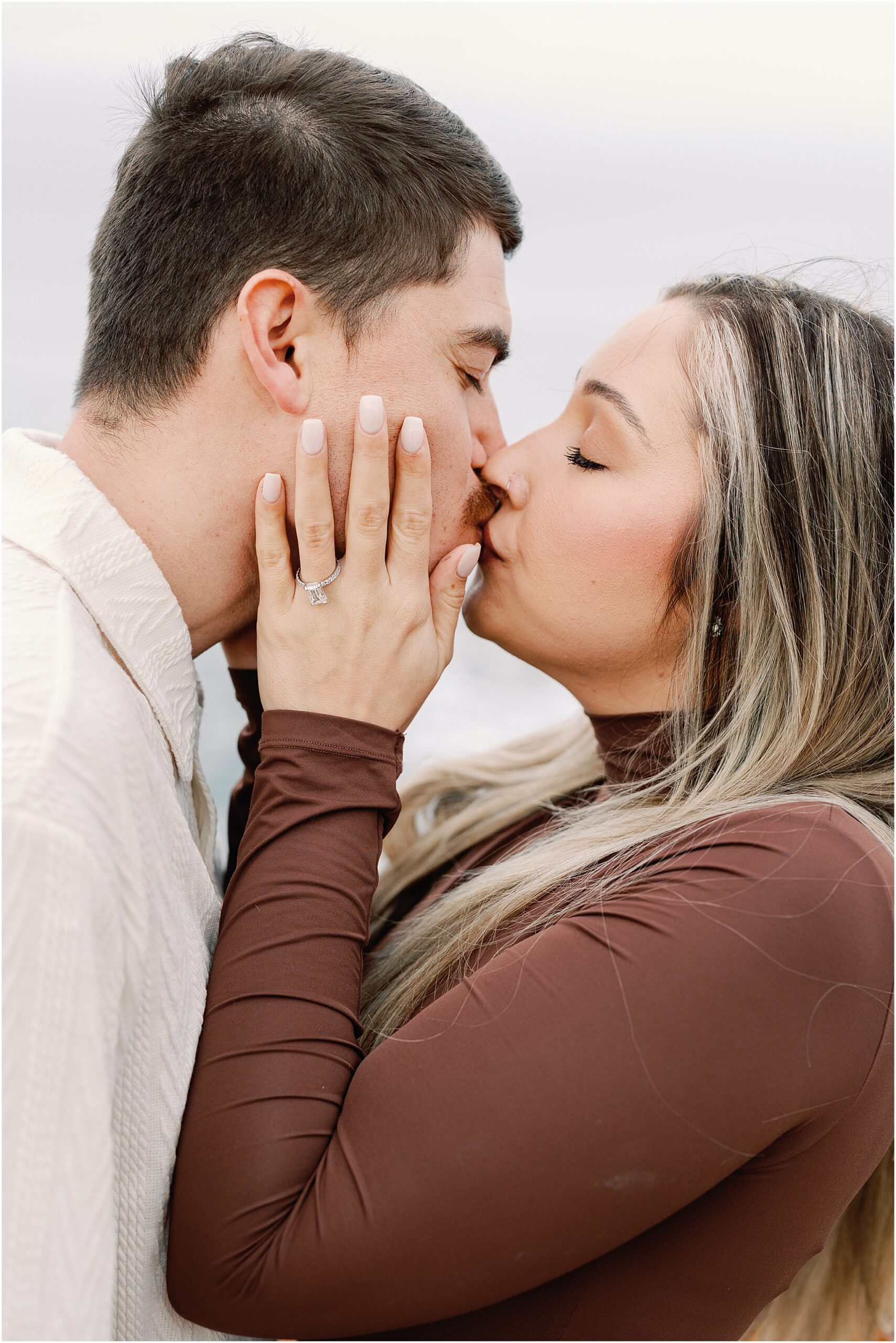 Their first kiss as an engaged couple on the Carmel beach.