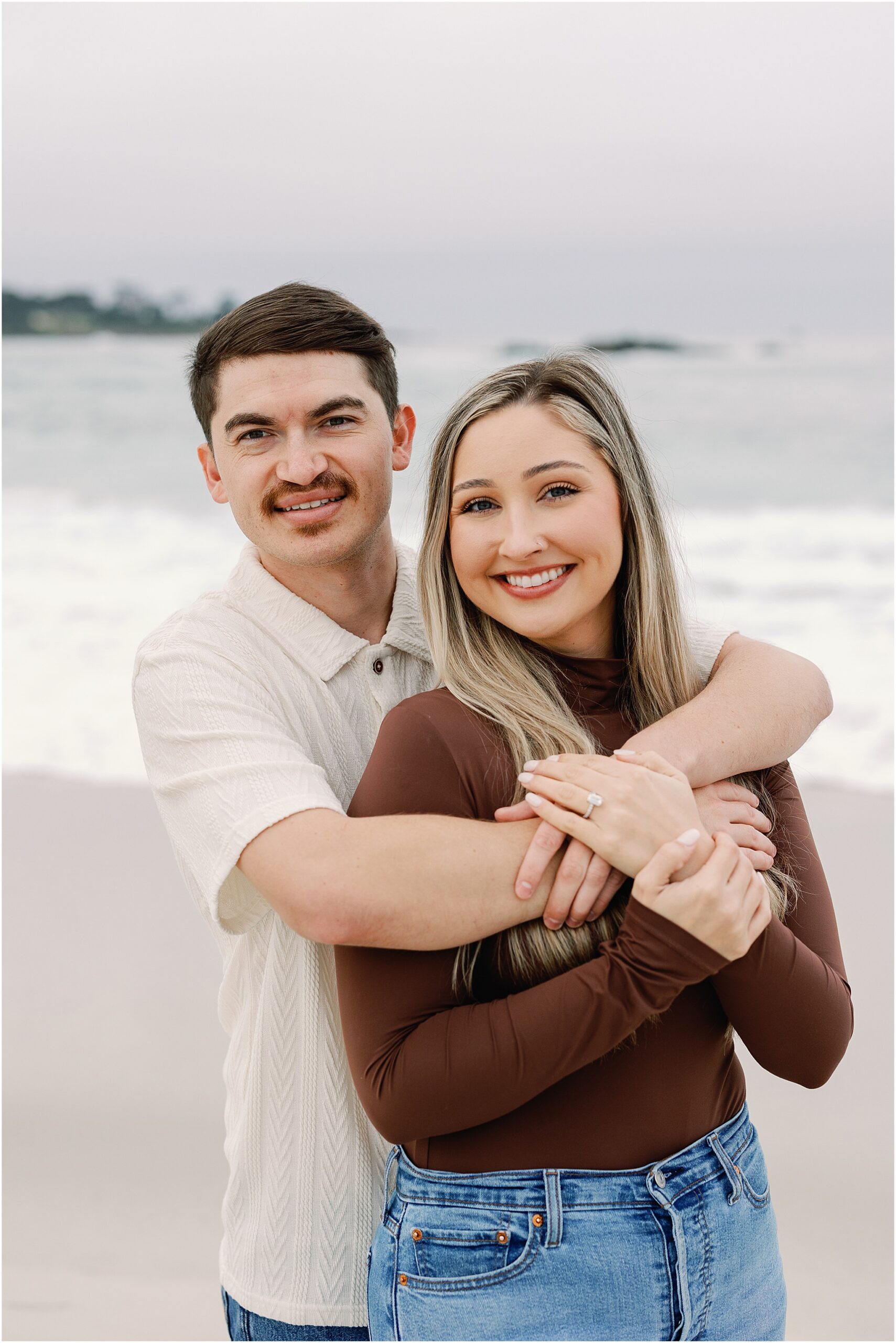Romantic beach portraits of Jacob and Hayley taken by a Carmel surprise proposal photographer.