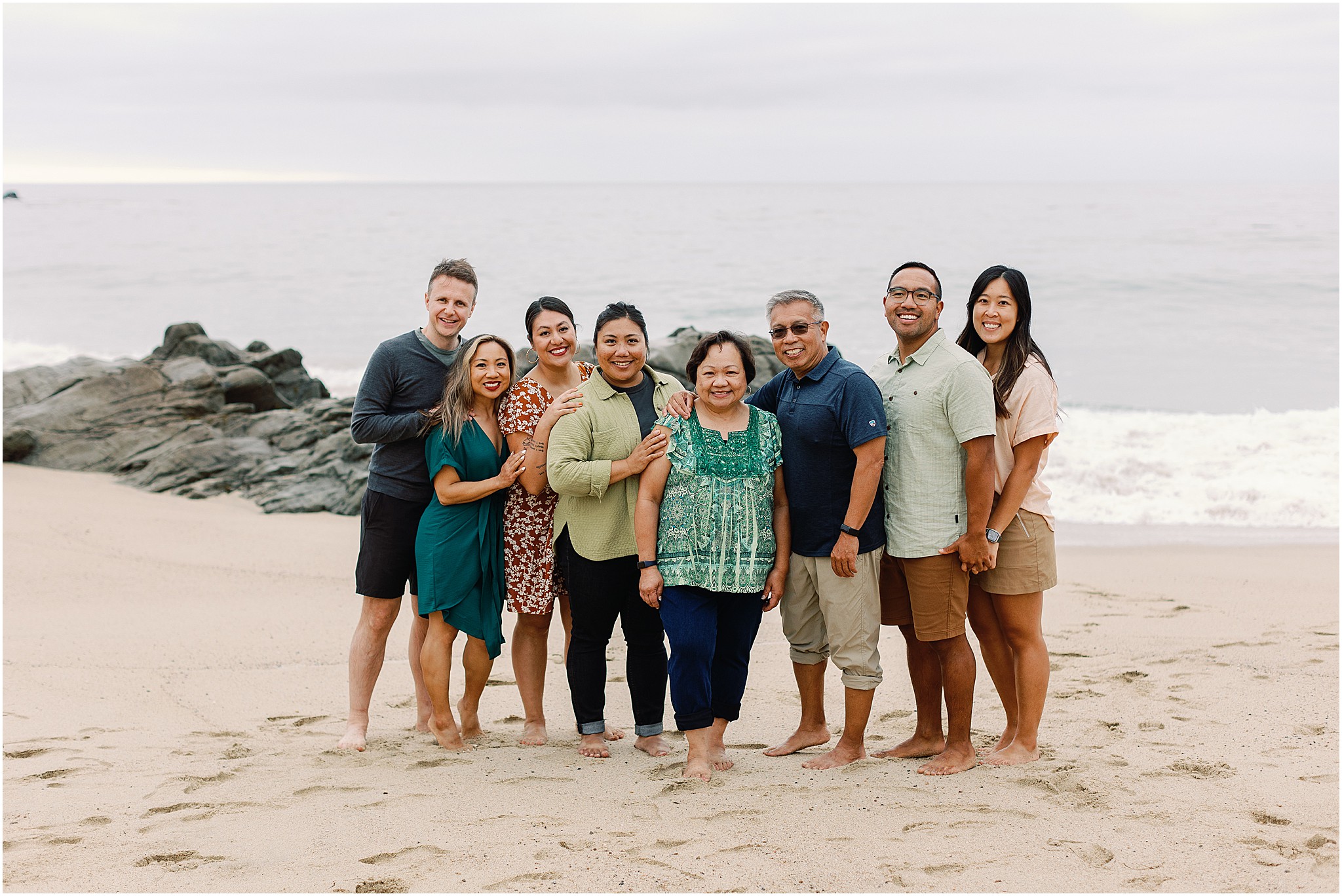 The Rozul Family together on the beach during their Big Sur family photo experience.
