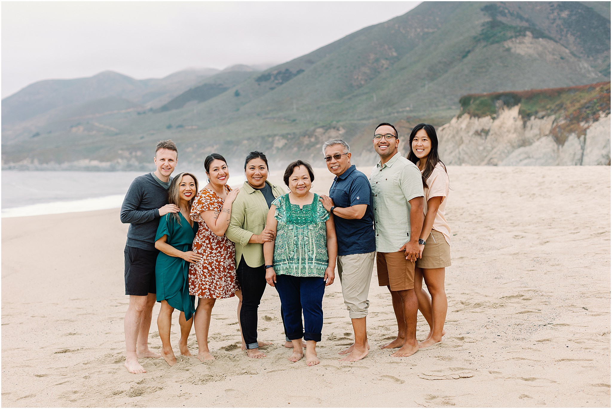 Family walking together on the beach during their Big Sur family photo experience.