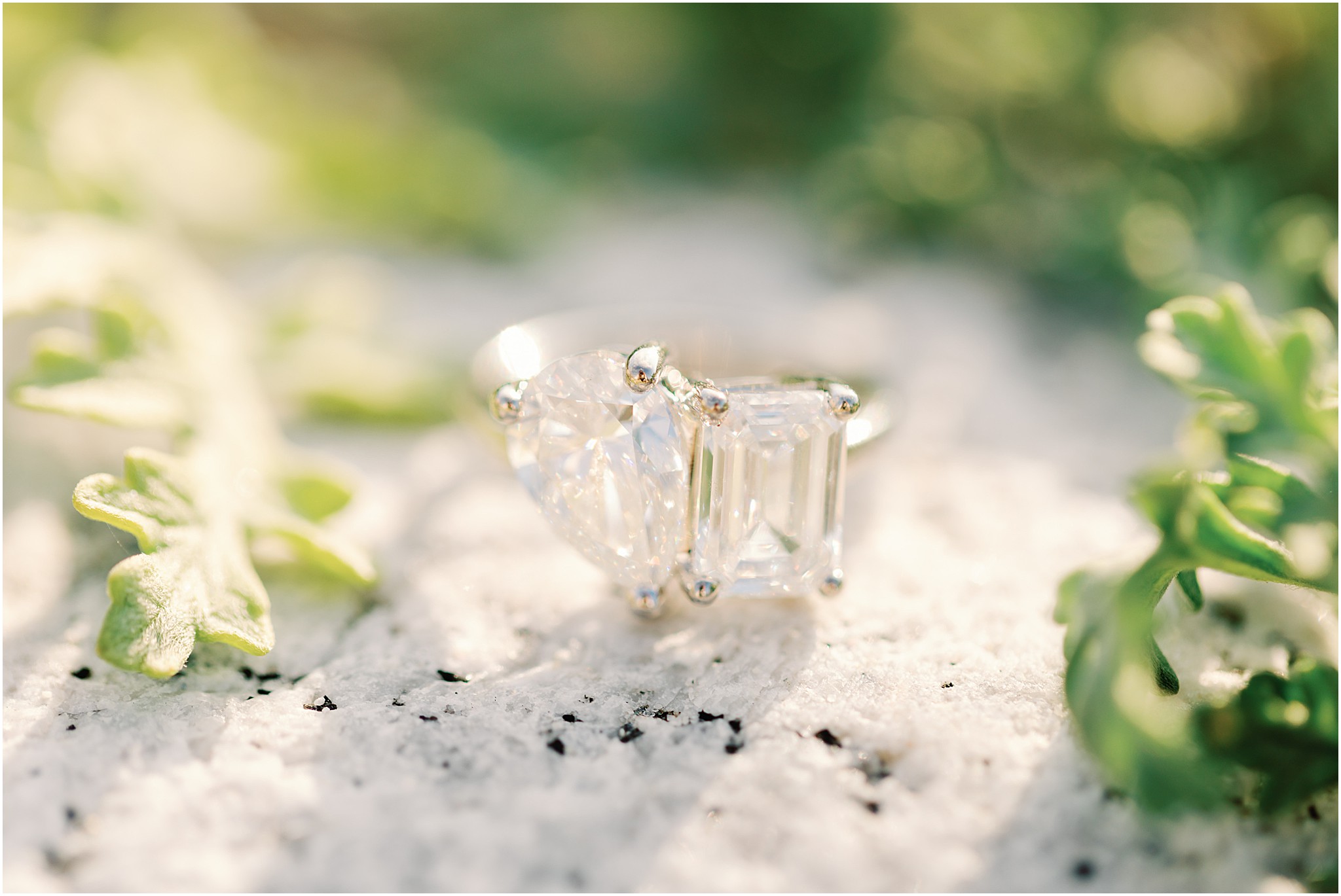 Close up of the engagement ring during a beach proposal