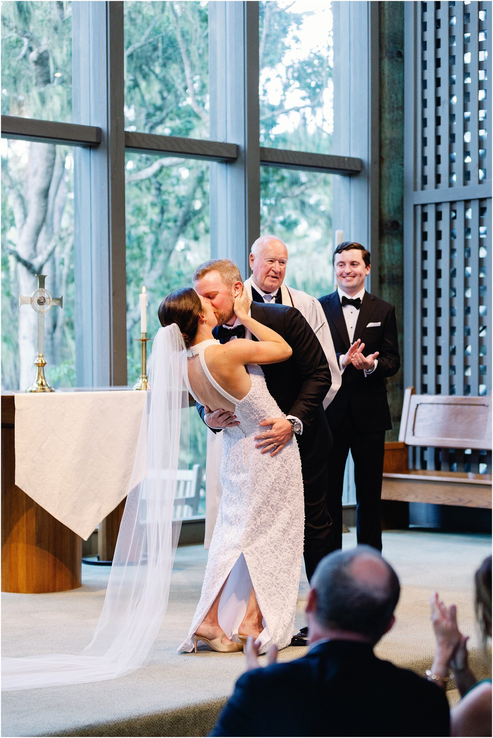 Couple’s first kiss at Church in the Forest ceremony.