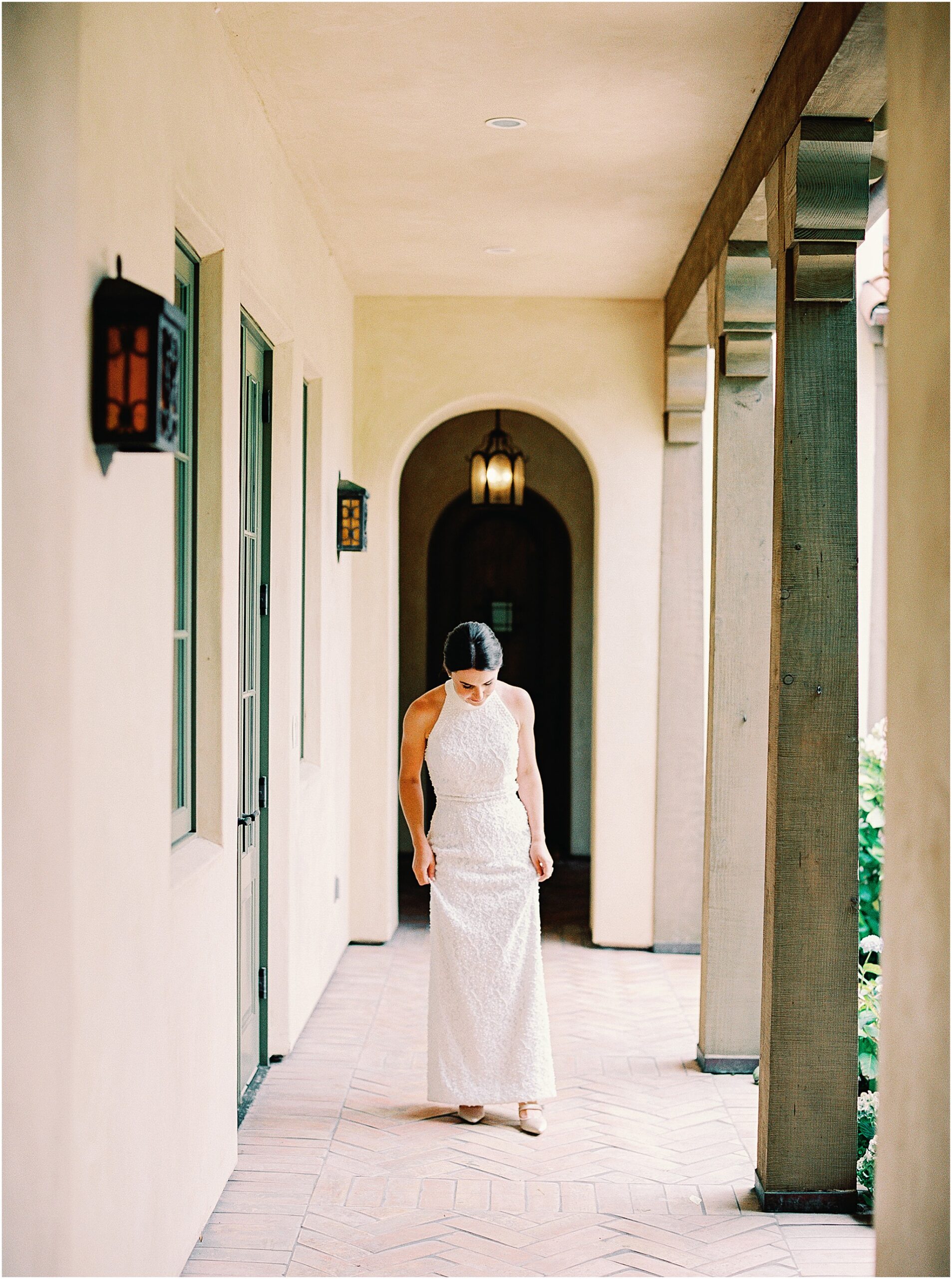 Bride getting ready in Pebble Beach home on wedding morning.