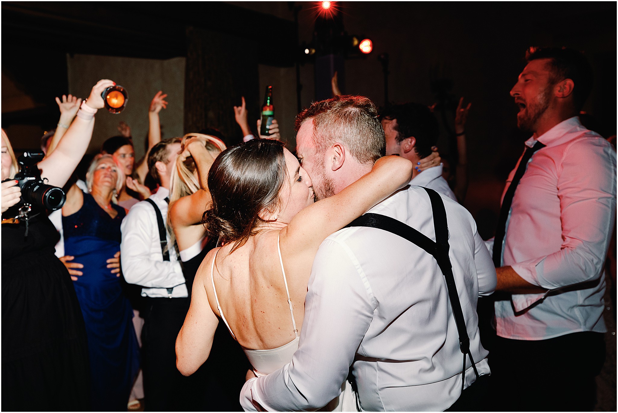 Bride and groom sharing a kiss at MPCC reception together.