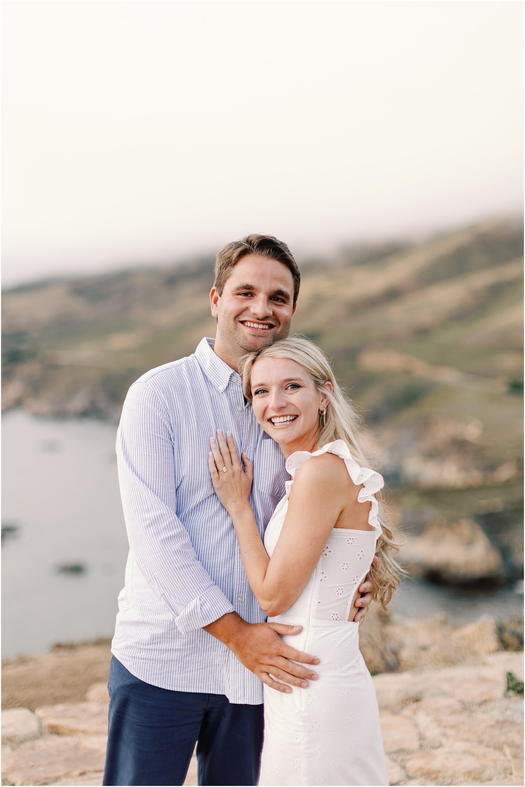 Engagement portraits with dreamy ocean haze and soft sunset light