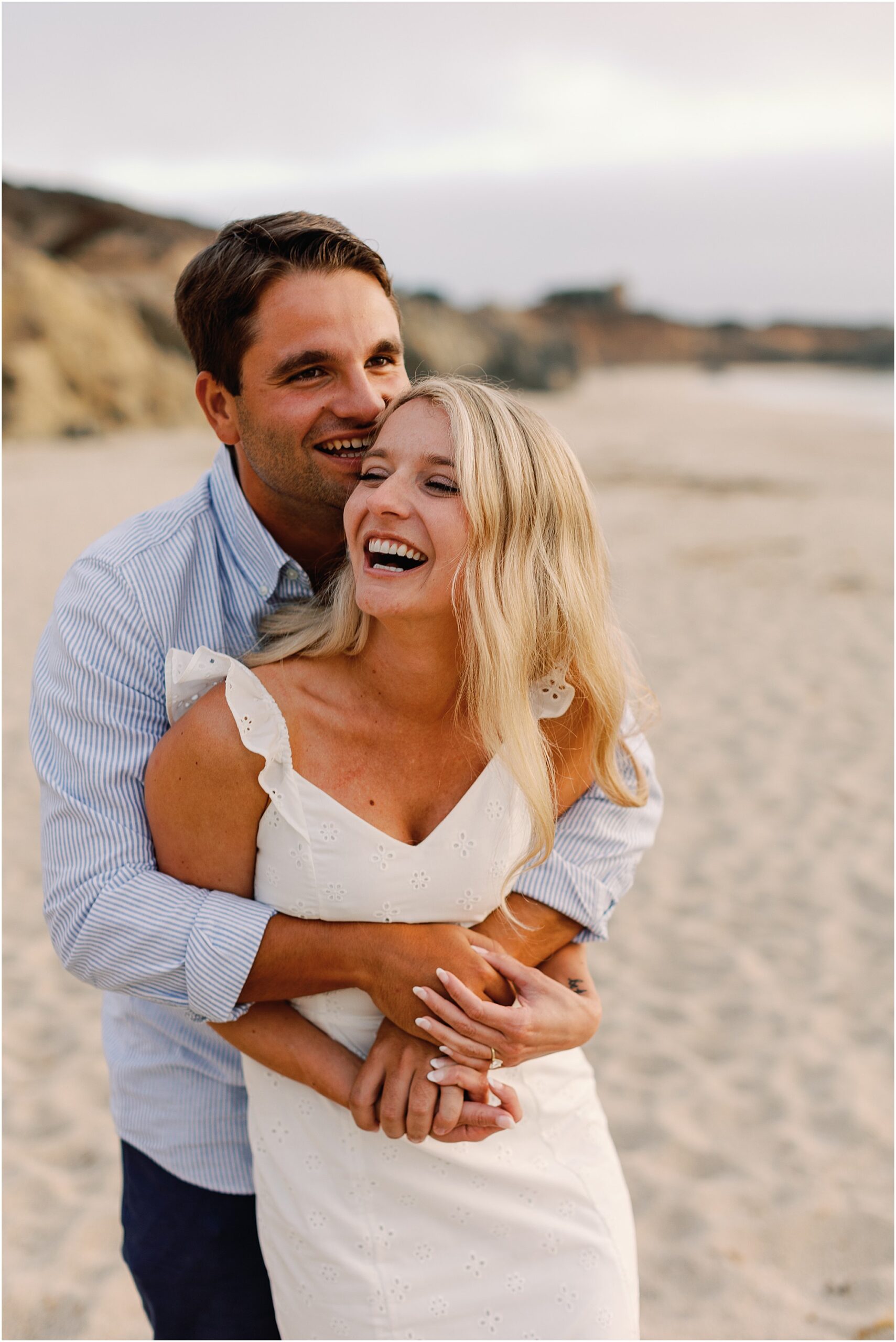 Romantic closeup of Tucker and Caitlin smiling and giggling after the proposal