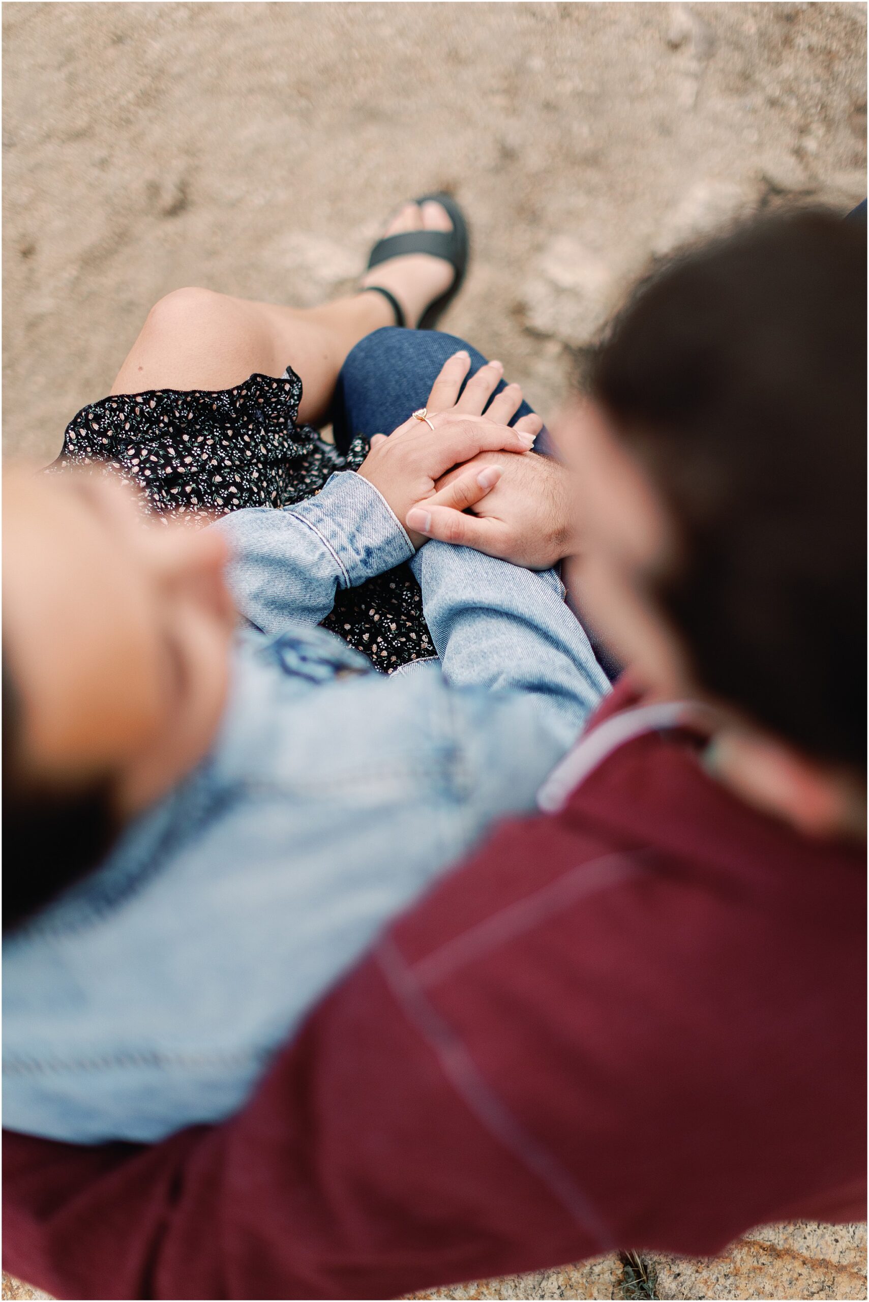 Over view shot of engagement ring on Anna’s hand during a Big Sur proposal photo shoot.