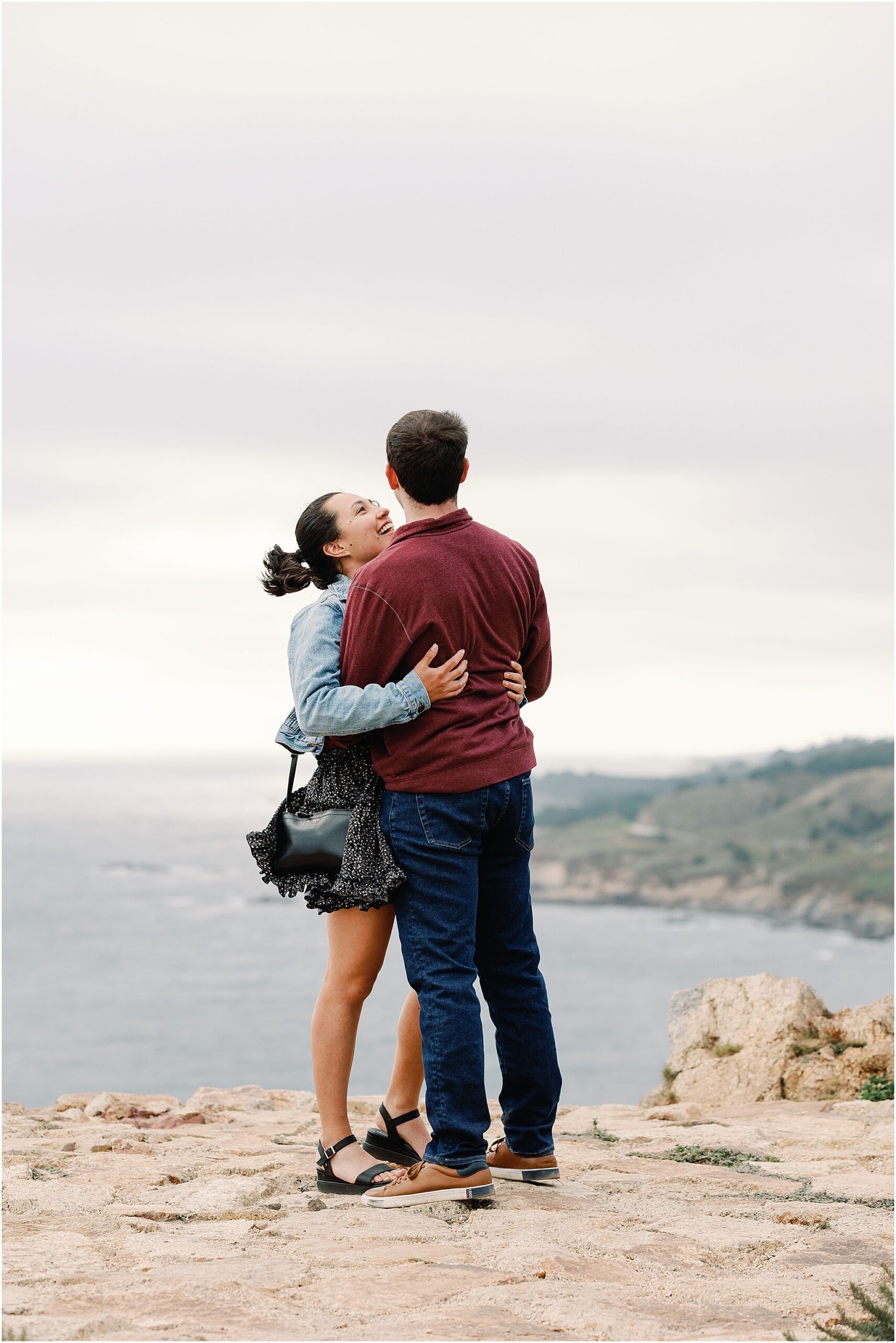 Anna hugging Ron tightly after saying yes during their Big Sur proposal session.