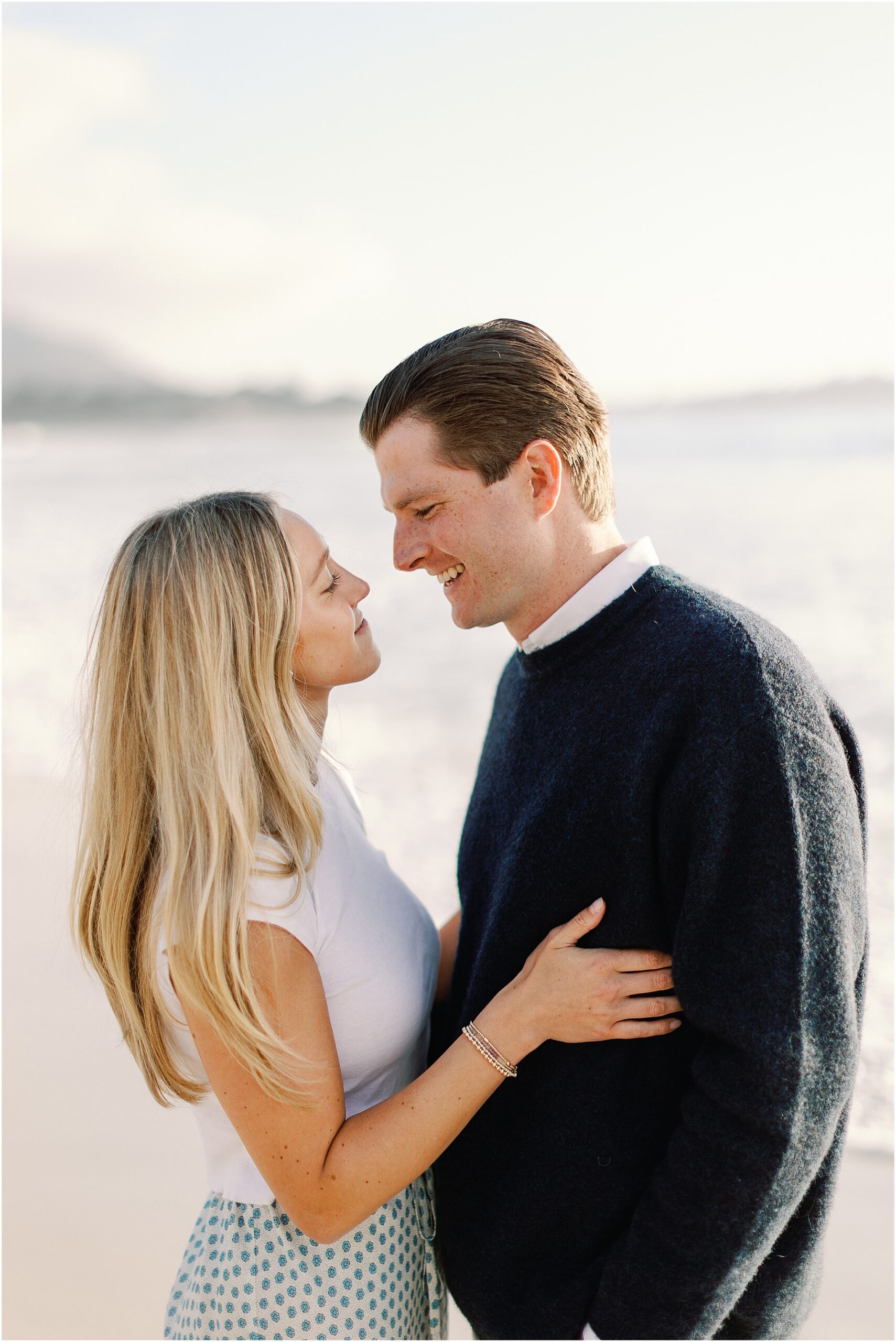 Intimate embrace during Carmel Beach engagement