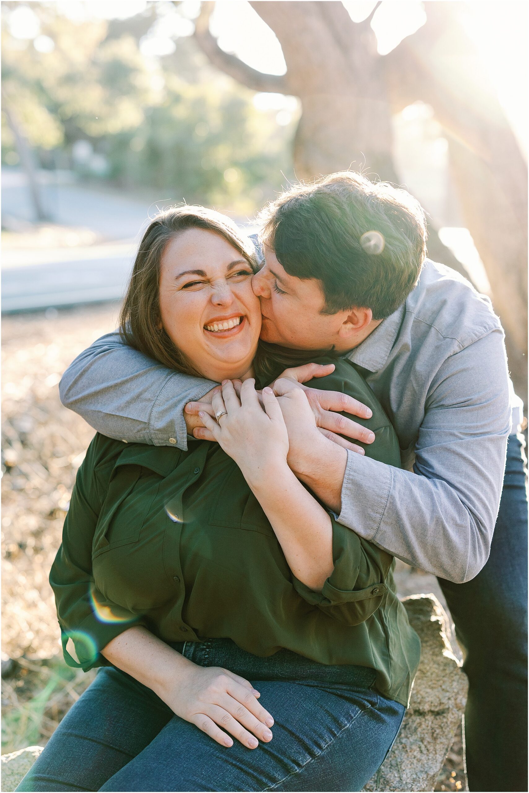 Intimate hug and kiss engagement photography session on the California coast.