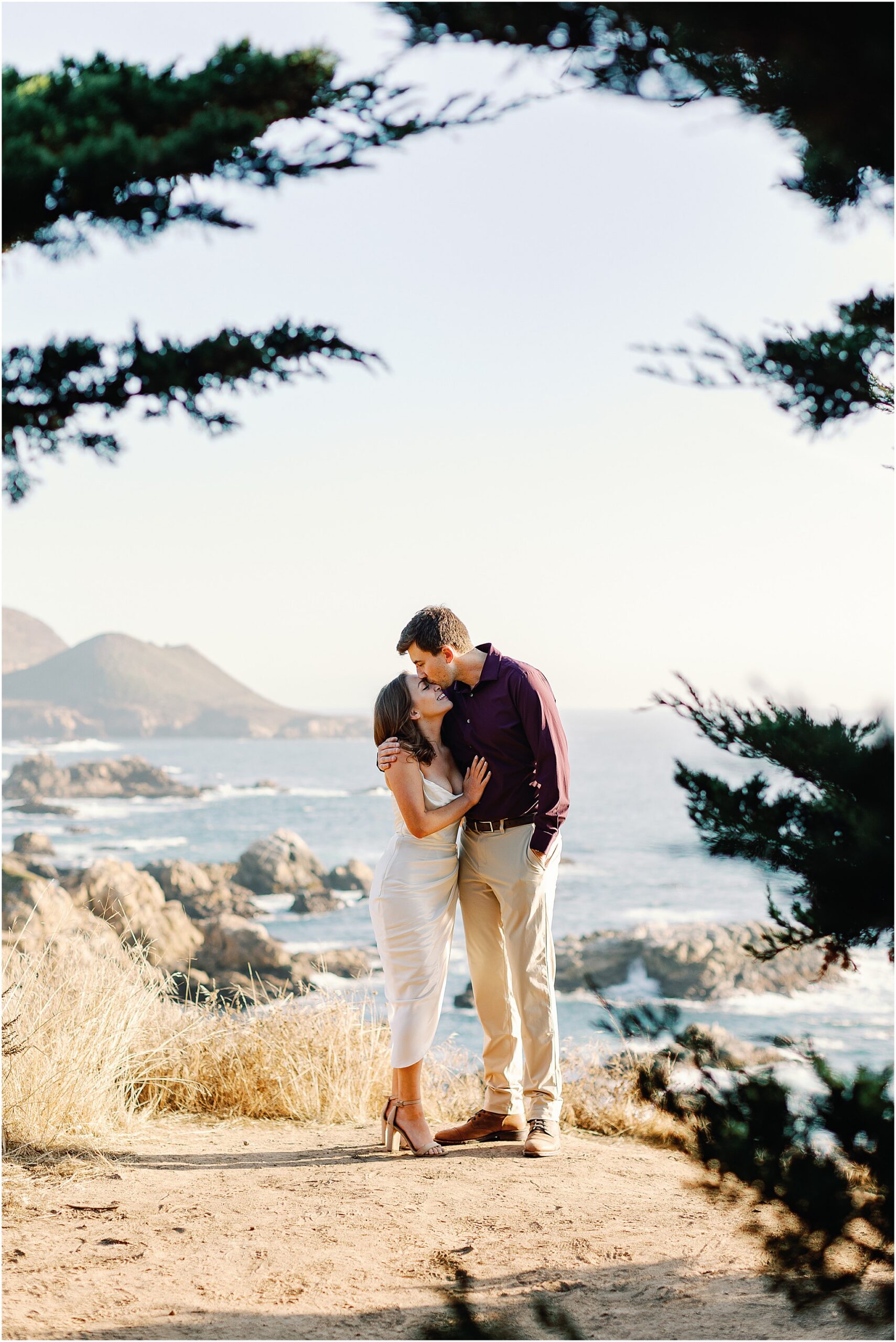 Joey kissing Jenny’s forehead during their engagement session