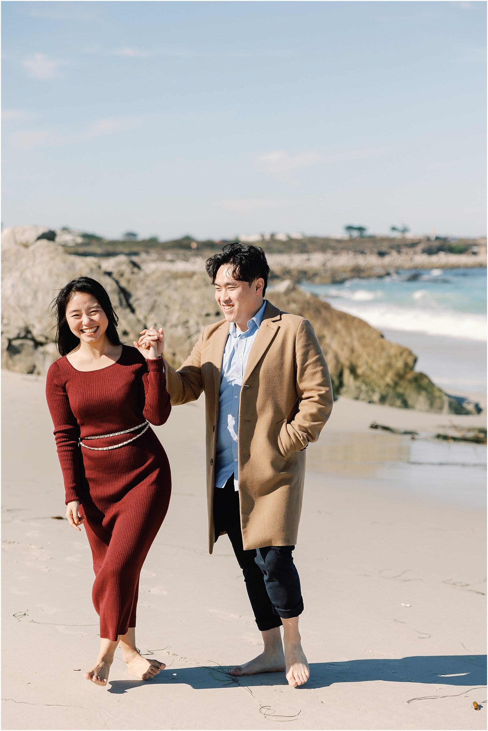 Couple enjoying newly engaged moment along California coast.