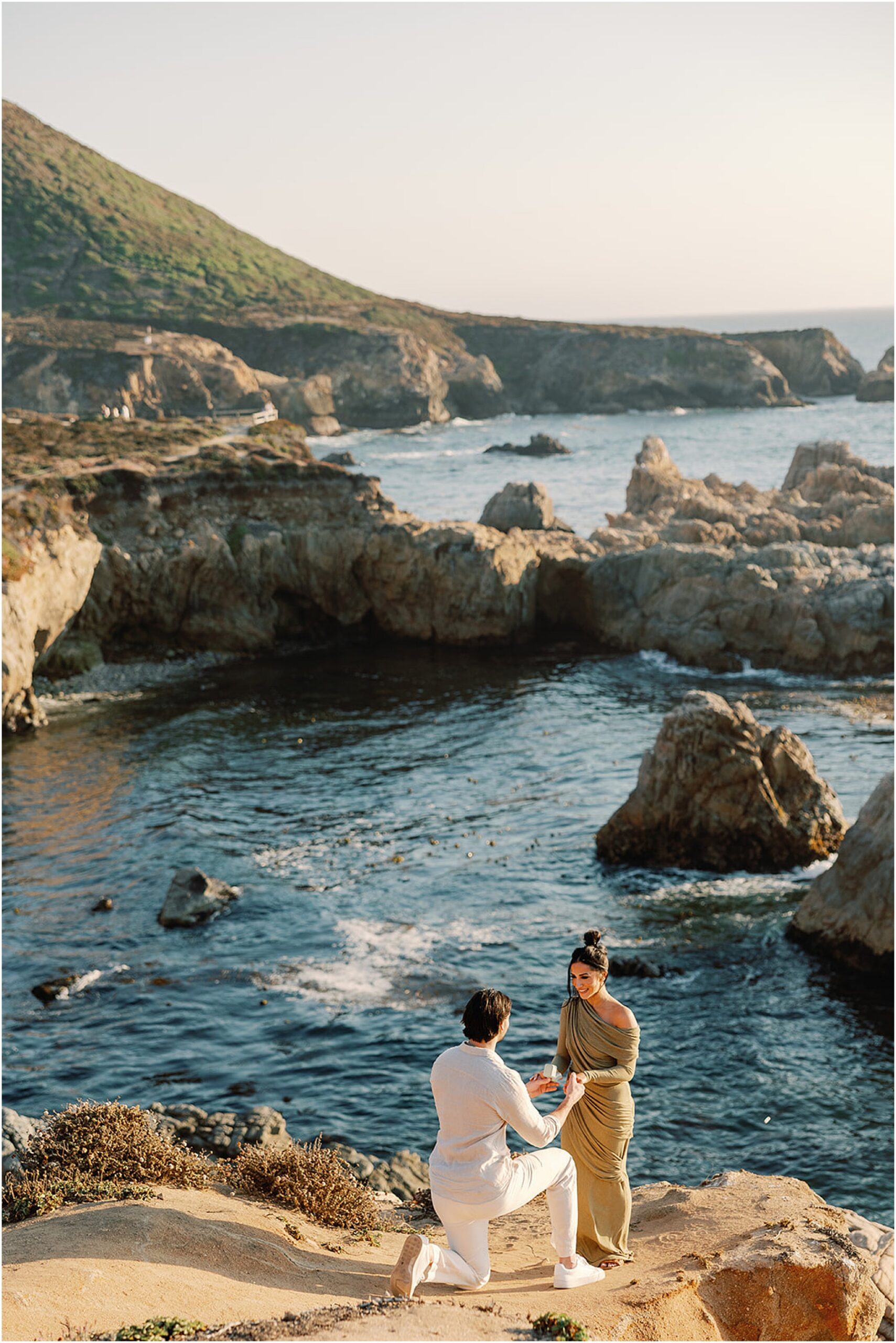 Proposal on a rocky coastal bluff with ocean views along the California coast.