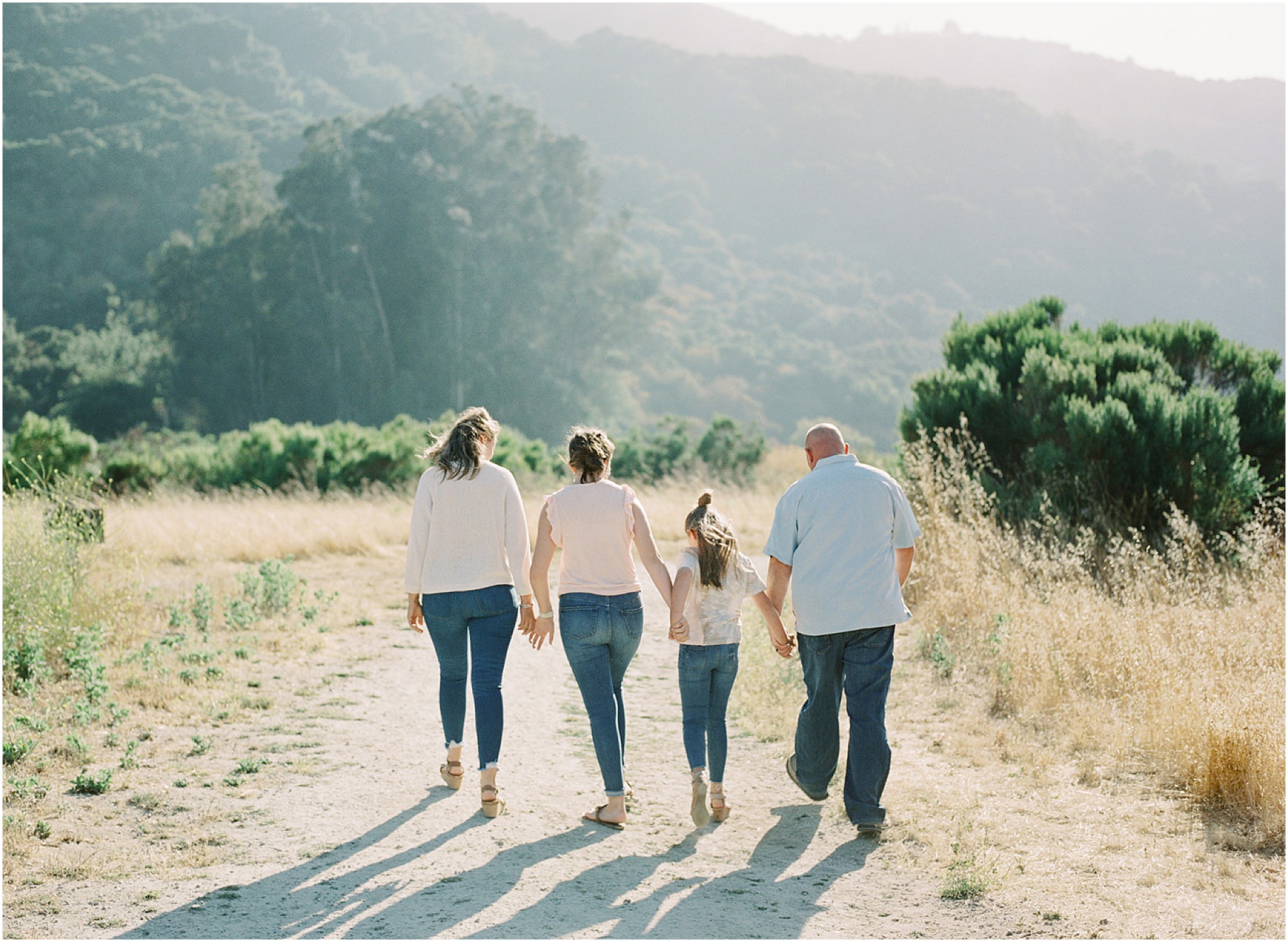 Family walking through the scenic Carmel Valley countryside