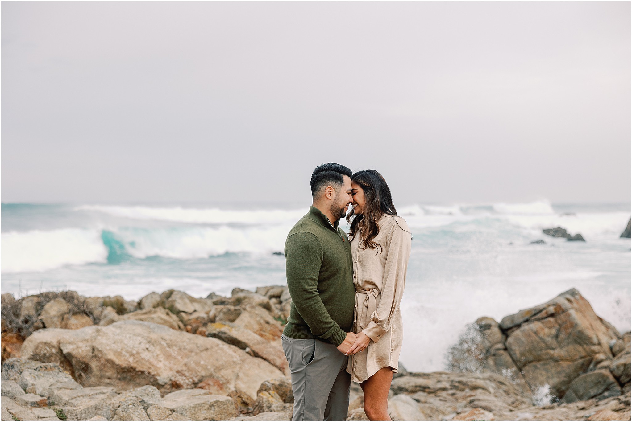 Christine and Carlos sharing a quiet moment together beside the waves during their Pebble Beach couples photography session